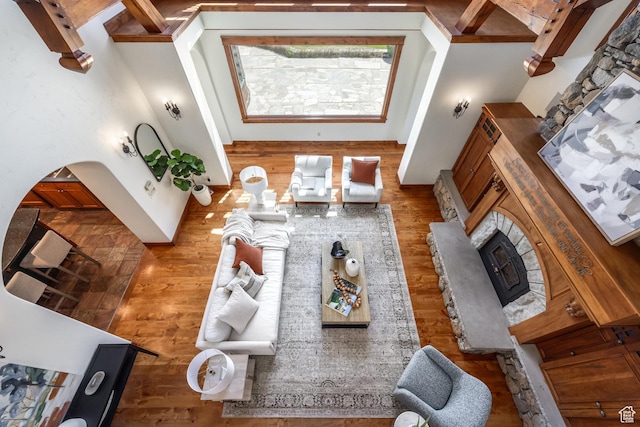 2000 W Red Hawk Trl, Park City, UT 84098 - living room featuring a fireplace, wood finished floors, and arched walkways