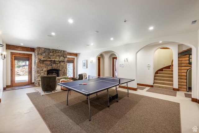 2000 W Red Hawk Trl, Park City, UT 84098 - rec room with recessed lighting, arched walkways, a stone fireplace, and baseboards