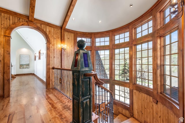 2000 W Red Hawk Trl, Park City, UT 84098 - hall featuring arched walkways, an upstairs landing, wood-type flooring, plenty of natural light, and wooden walls