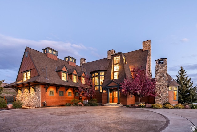 2000 W Red Hawk Trl, Park City, UT 84098 - shingle-style home featuring a chimney, curved driveway, roof with shingles, and stone siding