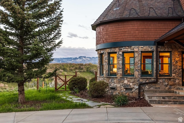 2000 W Red Hawk Trl, Park City, UT 84098 - view of side of property featuring stone siding, a mountain view, and roof with shingles