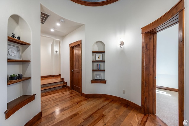 2000 W Red Hawk Trl, Park City, UT 84098 - hall with built in shelves, wood finished floors, baseboards, and stairs