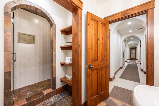 2000 W Red Hawk Trl, Park City, UT 84098 - full bath featuring a shower stall, baseboards, and stone finish flooring