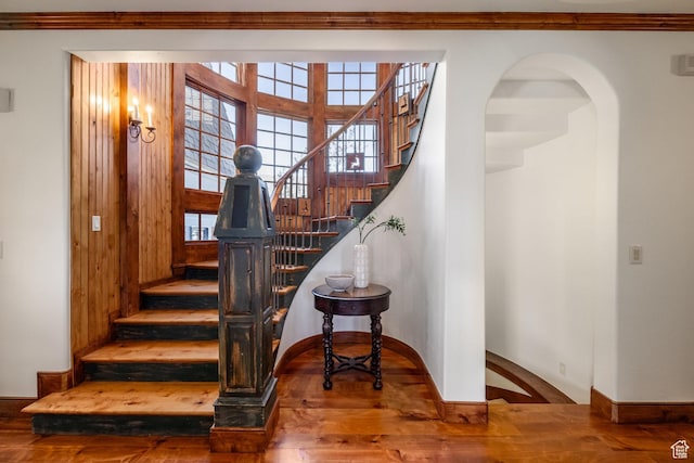 2000 W Red Hawk Trl, Park City, UT 84098 - stairs with wood finished floors, ornamental molding, and arched walkways