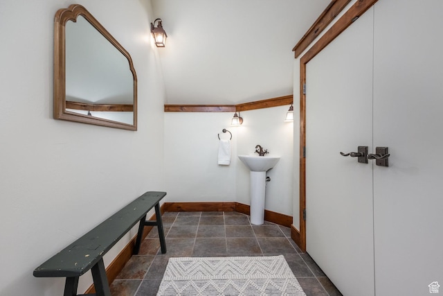 2000 W Red Hawk Trl, Park City, UT 84098 - bathroom featuring stone finish floors, baseboards, and a sink