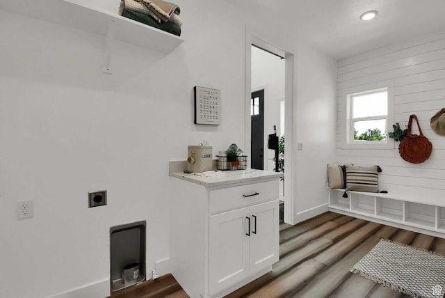mudroom with wood finished floors, recessed lighting, and baseboards