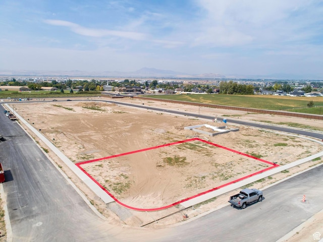 aerial view of property's location featuring property parcel outlined and a mountainous background