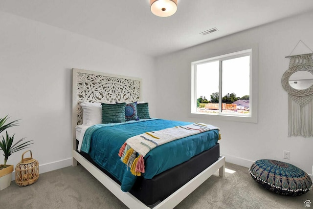 bedroom with carpet and baseboards