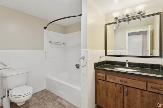 515 S 1000 E Unit 202, Salt Lake City, UT 84102 - bathroom with tile walls,  shower combination, toilet, wainscoting, and vanity