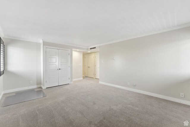 515 S 1000 E Unit 202, Salt Lake City, UT 84102 - unfurnished bedroom with crown molding, carpet, and baseboards