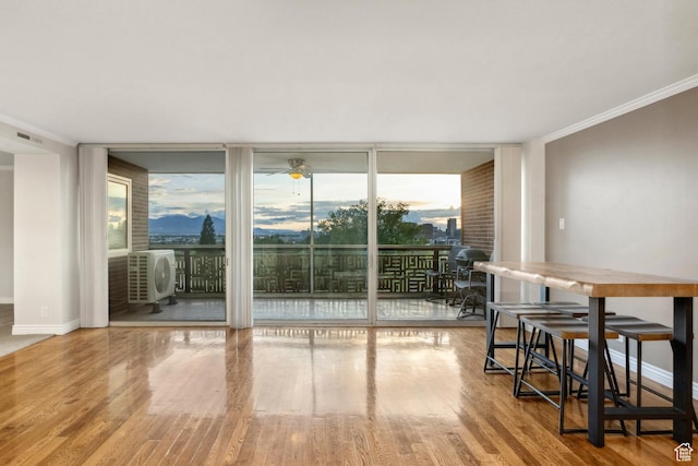 515 S 1000 E Unit 202, Salt Lake City, UT 84102 - dining space featuring floor to ceiling windows, plenty of natural light, wood finished floors, ornamental molding, and baseboards