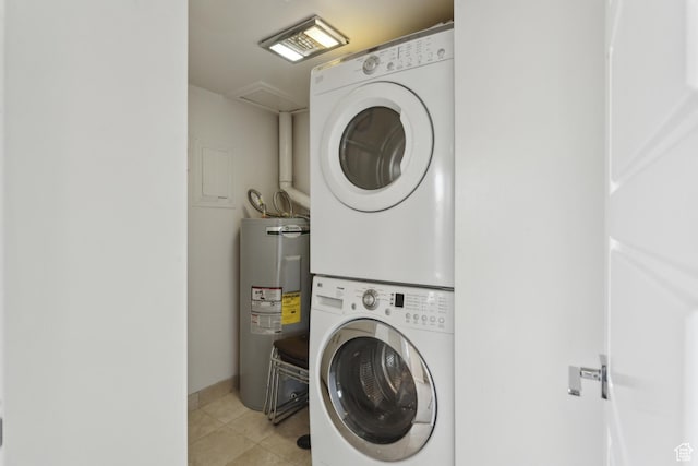 515 S 1000 E Unit 202, Salt Lake City, UT 84102 - clothes washing area with stacked washer / dryer, water heater, and light tile patterned flooring