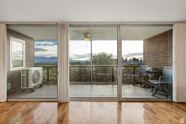 515 S 1000 E Unit 202, Salt Lake City, UT 84102 - entryway with a wall of windows, plenty of natural light, wood finished floors, a cooling unit, and a ceiling fan