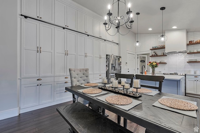 dining space featuring a chandelier, dark wood-style flooring, and recessed lighting