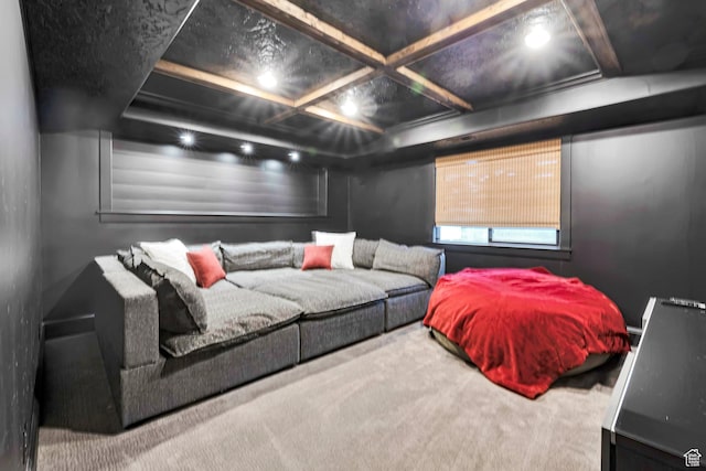 carpeted home theater featuring coffered ceiling and beam ceiling
