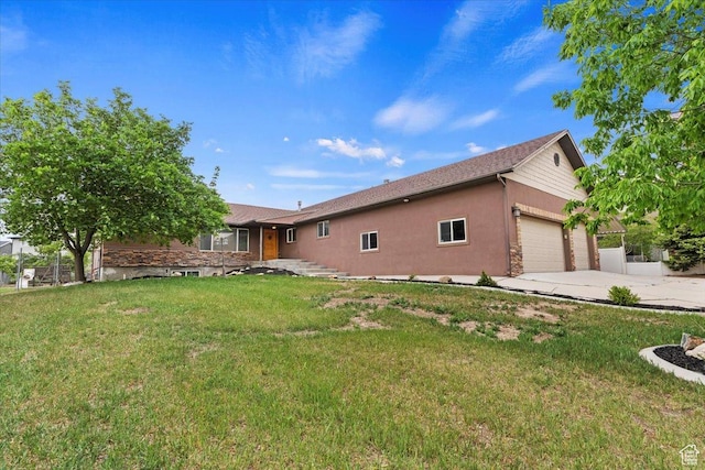 back of property featuring a garage, concrete driveway, a lawn, and stucco siding