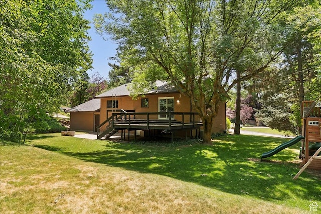 384 W 4200 N, Pleasant View, UT 84414 - view of grassy yard with a playground, a wooden deck, and stairway