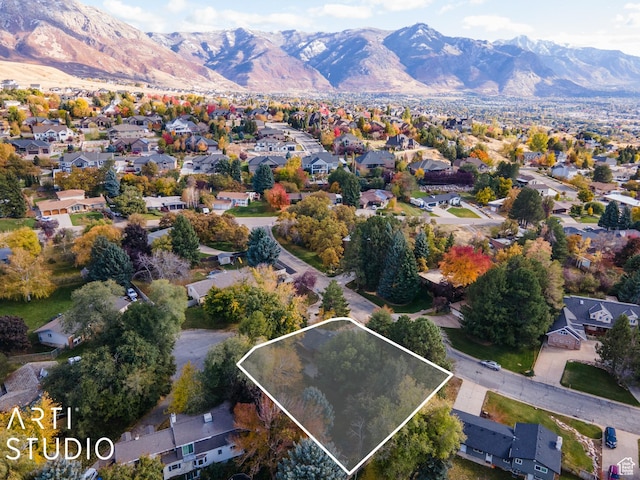 384 W 4200 N, Pleasant View, UT 84414 - aerial view of property and surrounding area featuring property boundaries highlighted, a mountain backdrop, and nearby suburban area
