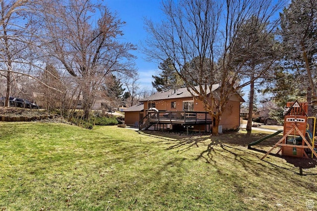 384 W 4200 N, Pleasant View, UT 84414 - view of grassy yard with a wooden deck and a playground