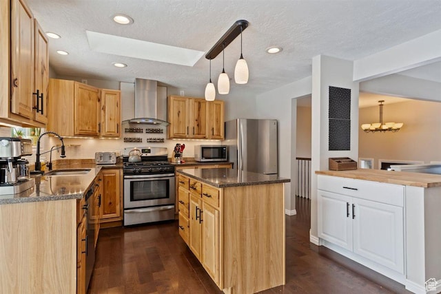 384 W 4200 N, Pleasant View, UT 84414 - kitchen with wall chimney range hood, stainless steel appliances, a sink, a skylight, and a textured ceiling