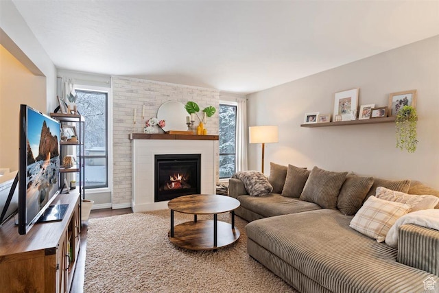 384 W 4200 N, Pleasant View, UT 84414 - living area with a fireplace, wood finished floors, and baseboards