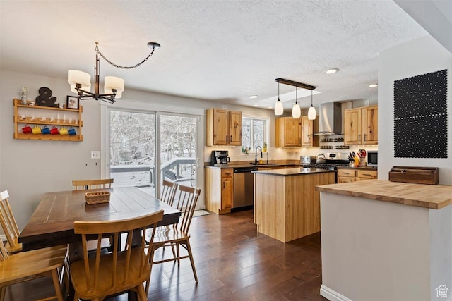 384 W 4200 N, Pleasant View, UT 84414 - kitchen with wall chimney exhaust hood, appliances with stainless steel finishes, a center island, dark wood finished floors, and a chandelier