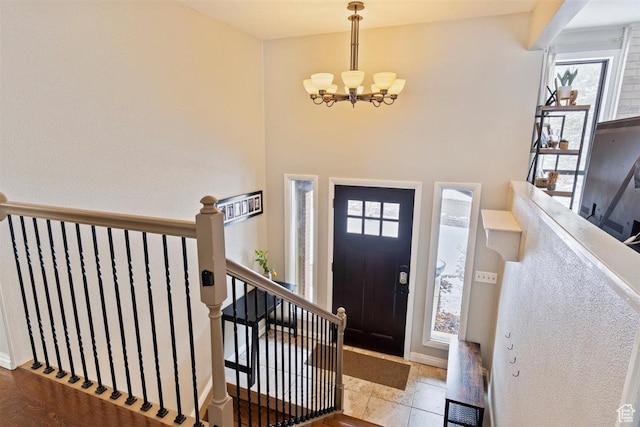 384 W 4200 N, Pleasant View, UT 84414 - entrance foyer featuring a chandelier, healthy amount of natural light, and baseboards