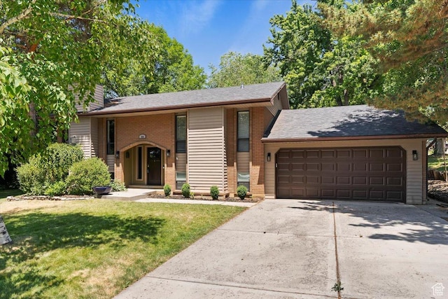 384 W 4200 N, Pleasant View, UT 84414 - view of front of house with an attached garage, brick siding, concrete driveway, a front lawn, and a chimney
