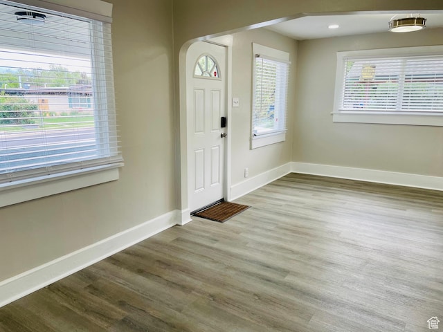 936 E Atkin Ave, Salt Lake City, UT 84106 - entryway with wood finished floors, baseboards, and arched walkways
