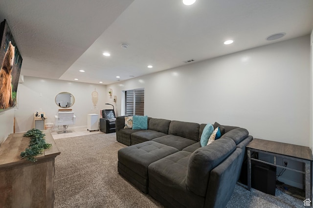 living area featuring carpet floors and recessed lighting