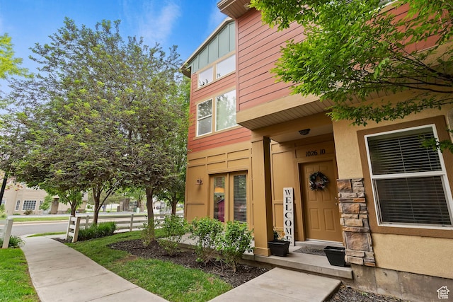 1026 N Shepard Creek Pkwy W Unit 10, Farmington, UT 84025 - doorway to property with stucco siding