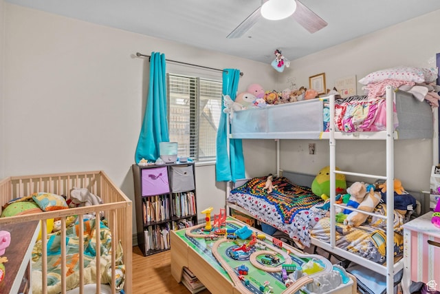 bedroom featuring wood finished floors and a ceiling fan