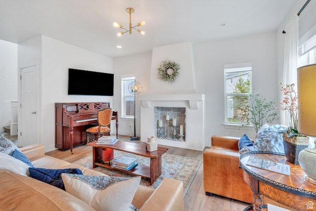 305 E 330 N, Vineyard, UT 84059 - living room featuring a chandelier, light wood finished floors, a fireplace, and recessed lighting