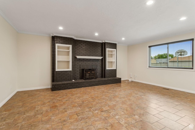 unfurnished living room with baseboards, recessed lighting, a fireplace, ornamental molding, and stone finish floors