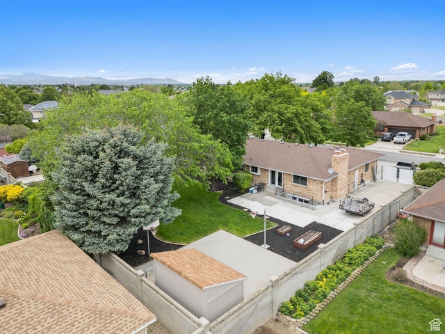 aerial perspective of suburban area with a mountainous background