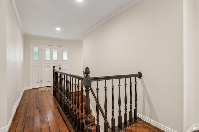stairway featuring crown molding, hardwood / wood-style flooring, baseboards, and recessed lighting