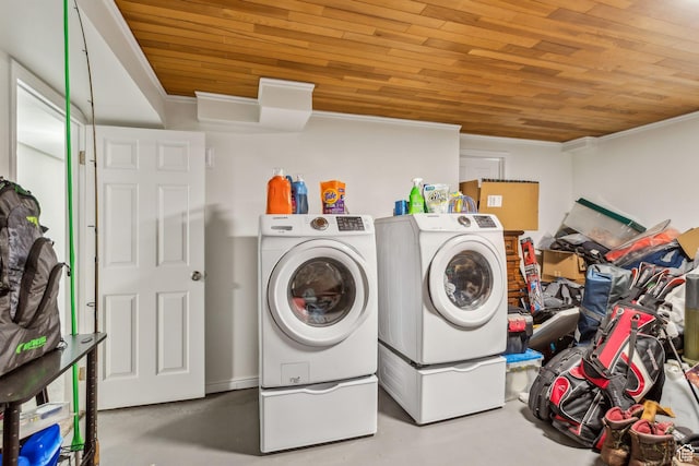 laundry room with crown molding, wooden ceiling, and washing machine and clothes dryer