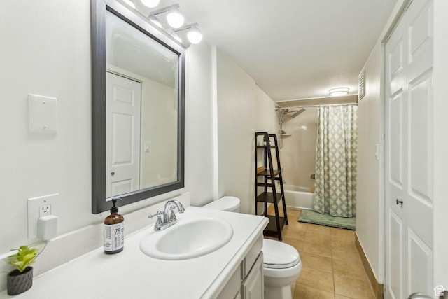 bathroom with toilet, tile patterned flooring, vanity, and shower / bath combination with curtain