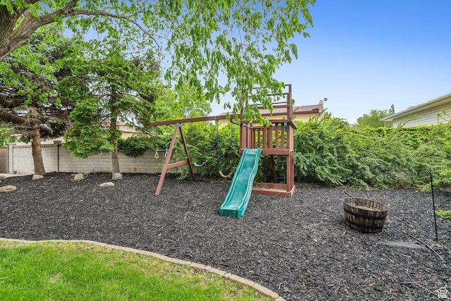 view of jungle gym with a fenced backyard