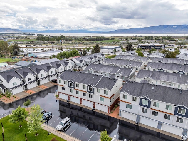 aerial view of residential area featuring mountains