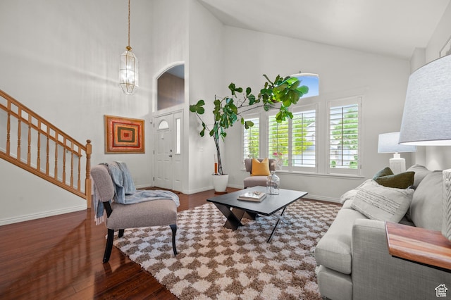 3678 S Vineyard Ct, Millcreek, UT 84106 - living area featuring wood finished floors, high vaulted ceiling, stairway, baseboards, and a chandelier