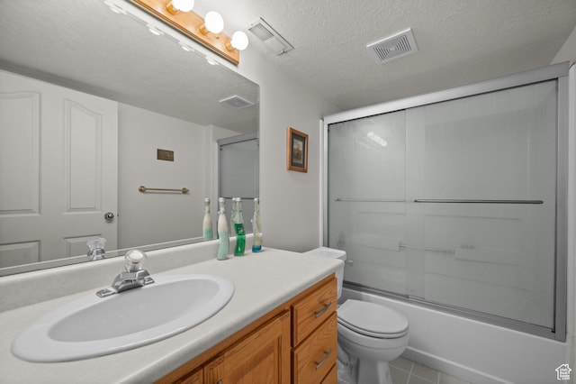 3678 S Vineyard Ct, Millcreek, UT 84106 - full bathroom with vanity, toilet, combined bath / shower with glass door, tile patterned floors, and a textured ceiling