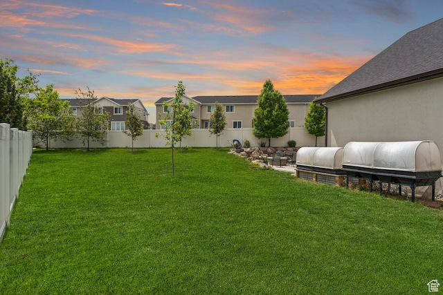 yard at dusk with a residential view