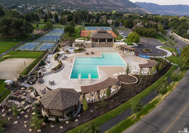 community pool with a mountain view