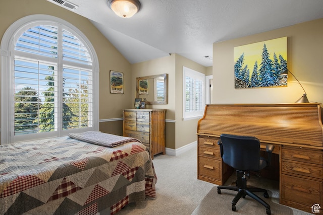 bedroom with light carpet, lofted ceiling, and baseboards