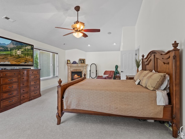 bedroom featuring carpet floors, a glass covered fireplace, ceiling fan, recessed lighting, and baseboards