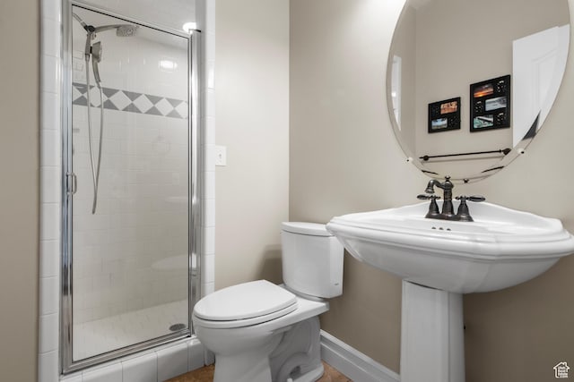 full bathroom with a stall shower and toilet