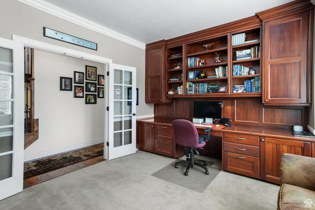 office area featuring french doors, ornamental molding, light carpet, and baseboards