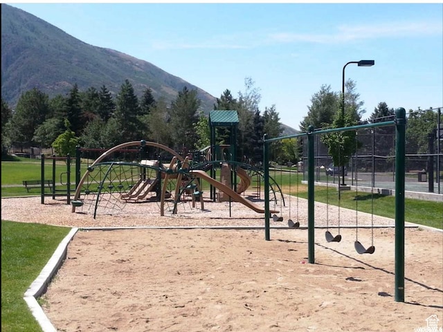 community jungle gym with a mountain view