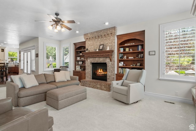 living room featuring baseboards, a ceiling fan, a brick fireplace, recessed lighting, and carpet floors